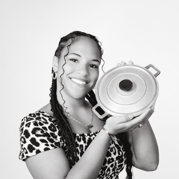 student holding cooking pot