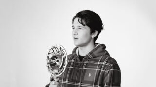 Student speaking into microphone