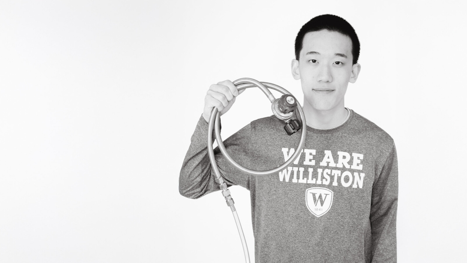 student holding scientific device