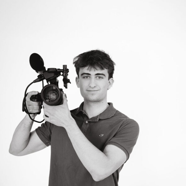 Student holding video camera