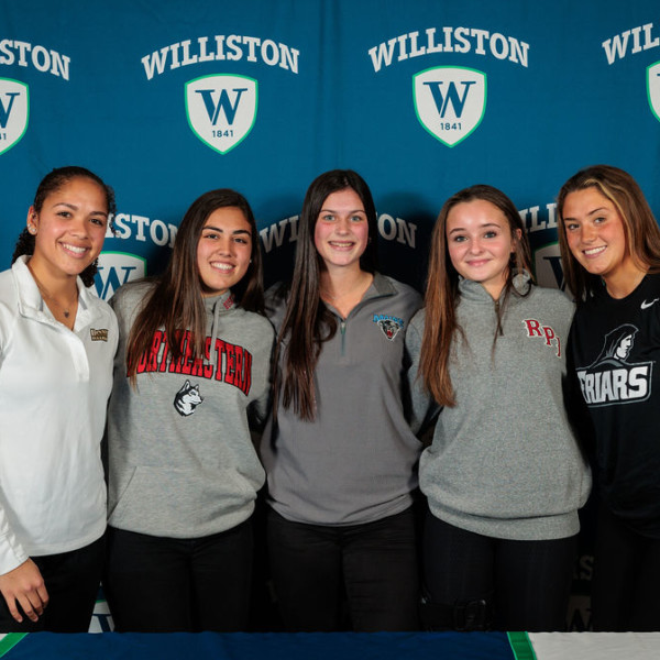 five girls with sports jerseys