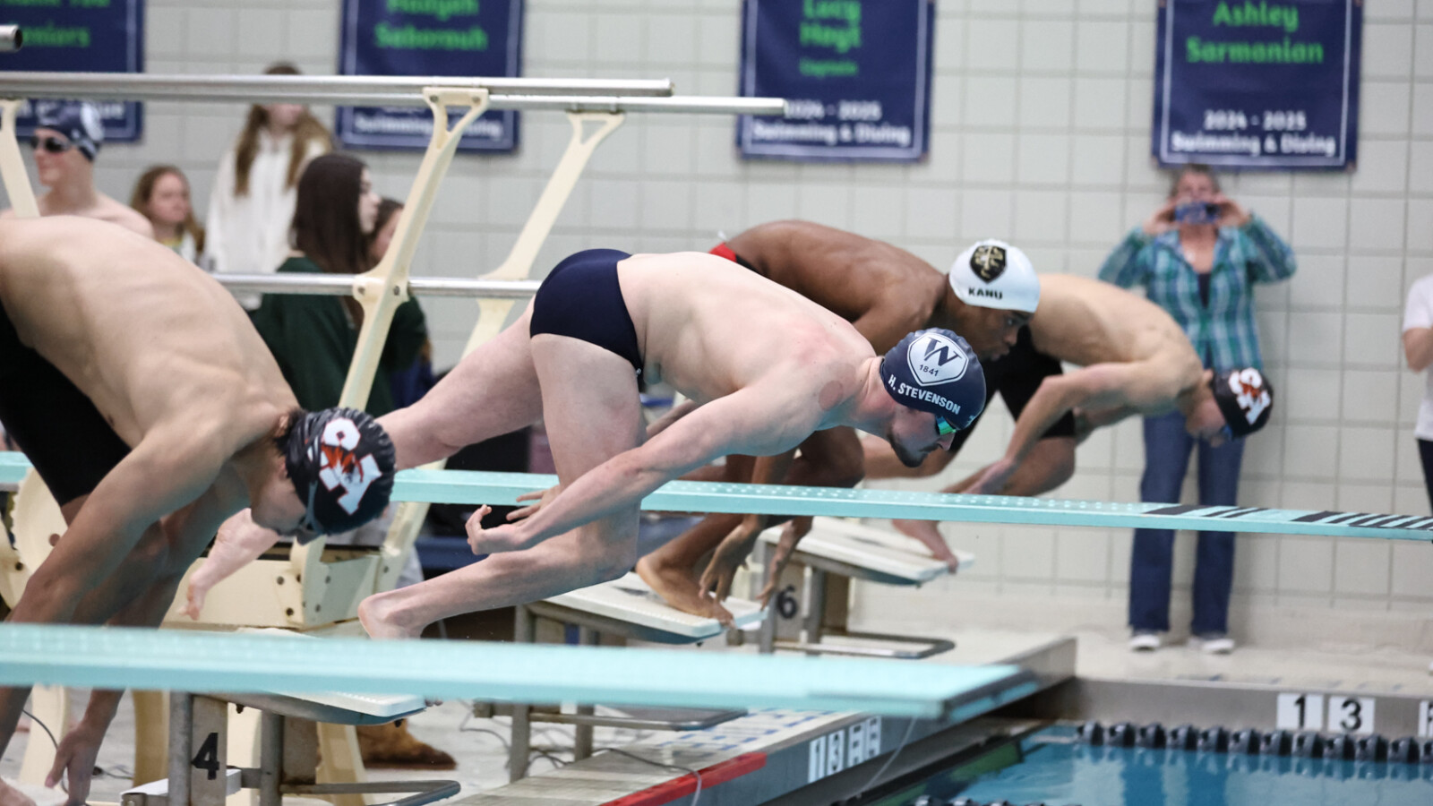 boys diving into pool