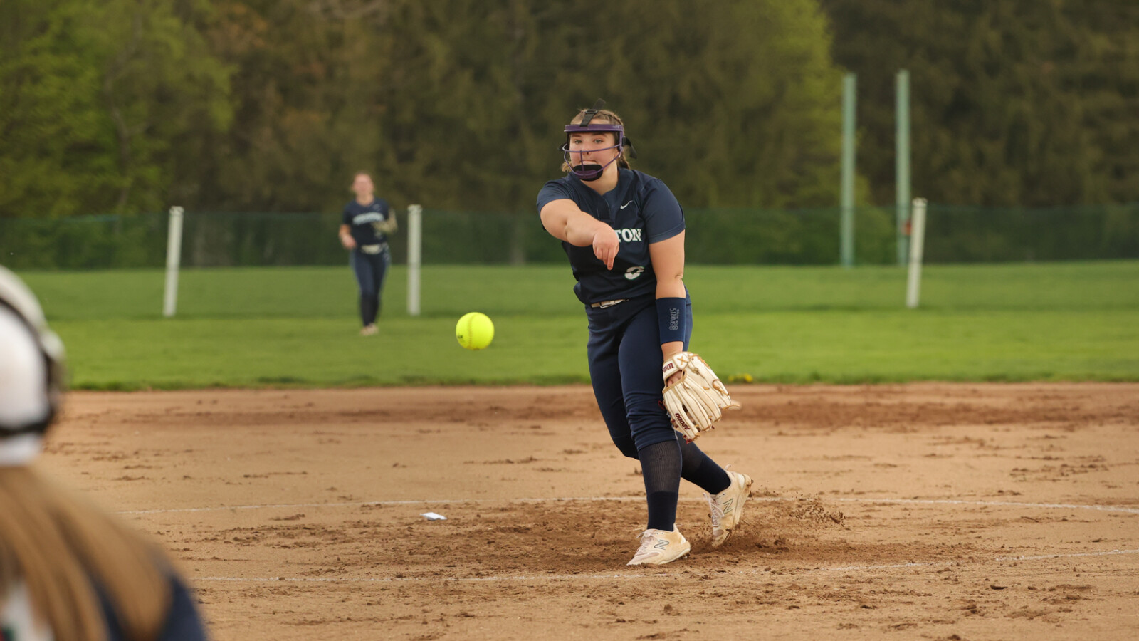 girl throwing a softball