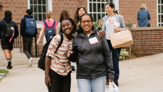 mother and daughter smiling and posing