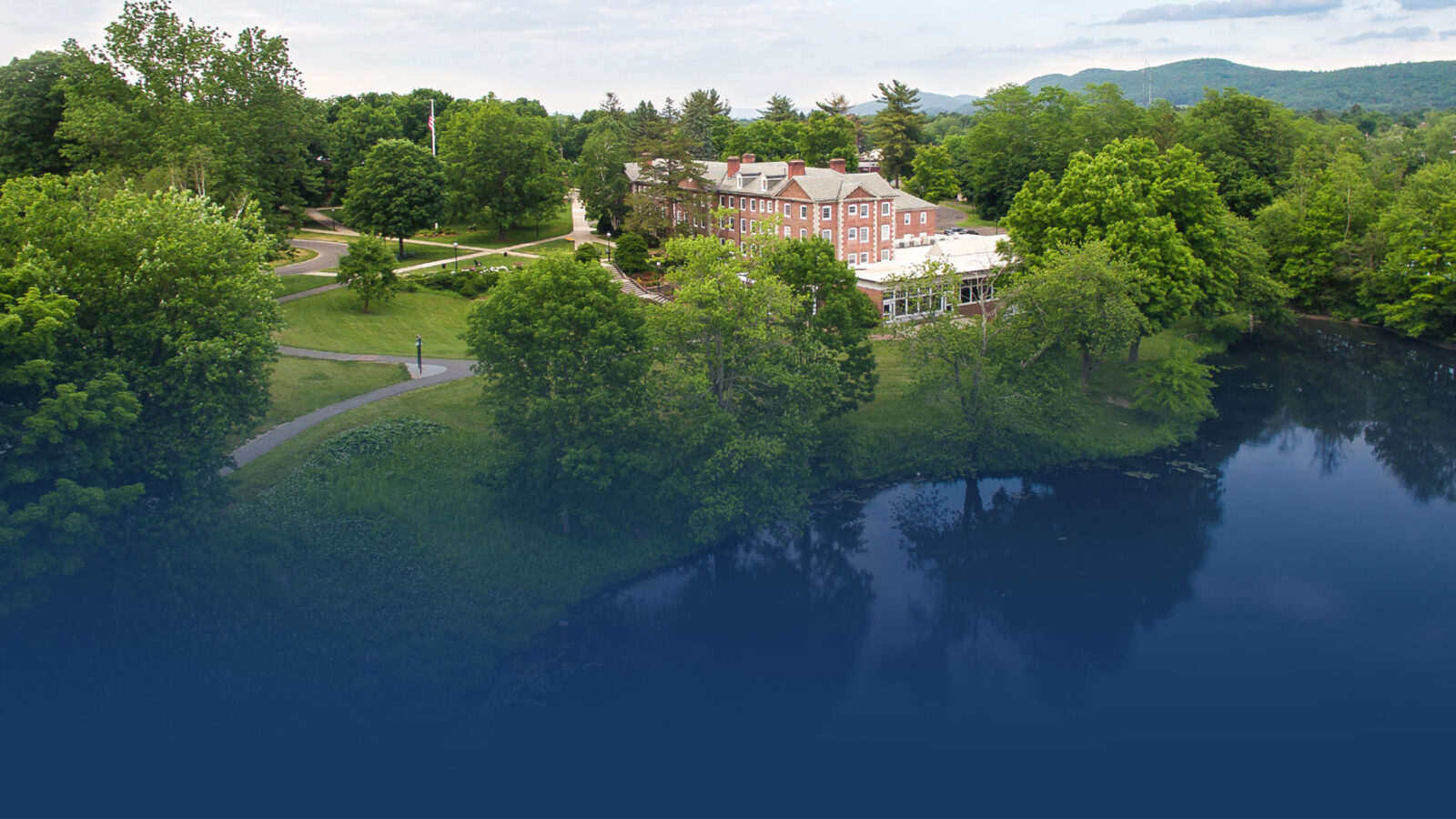 aerial photo of campus with blue fade