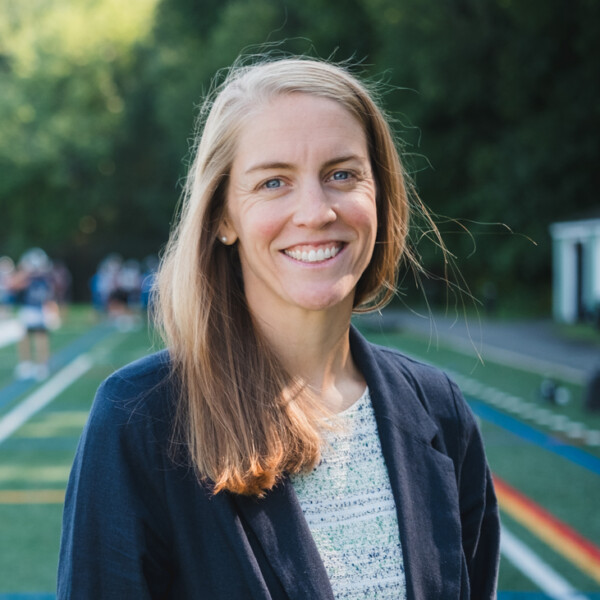 woman standing on athletic field