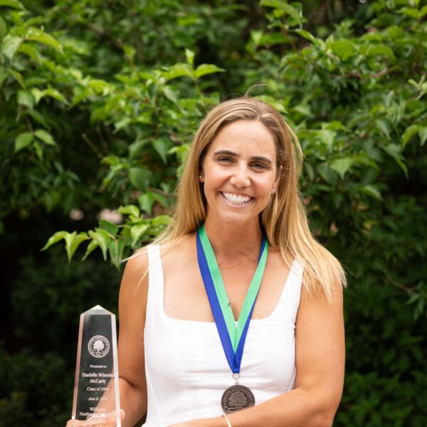 woman posing with trophy
