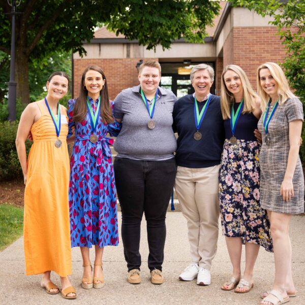 group of women posing with medals