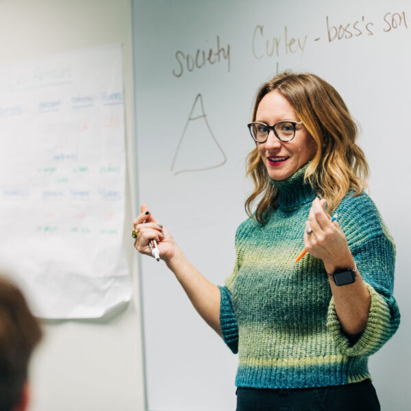 teacher in front of white board