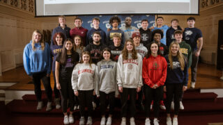 students with college sweatshirts